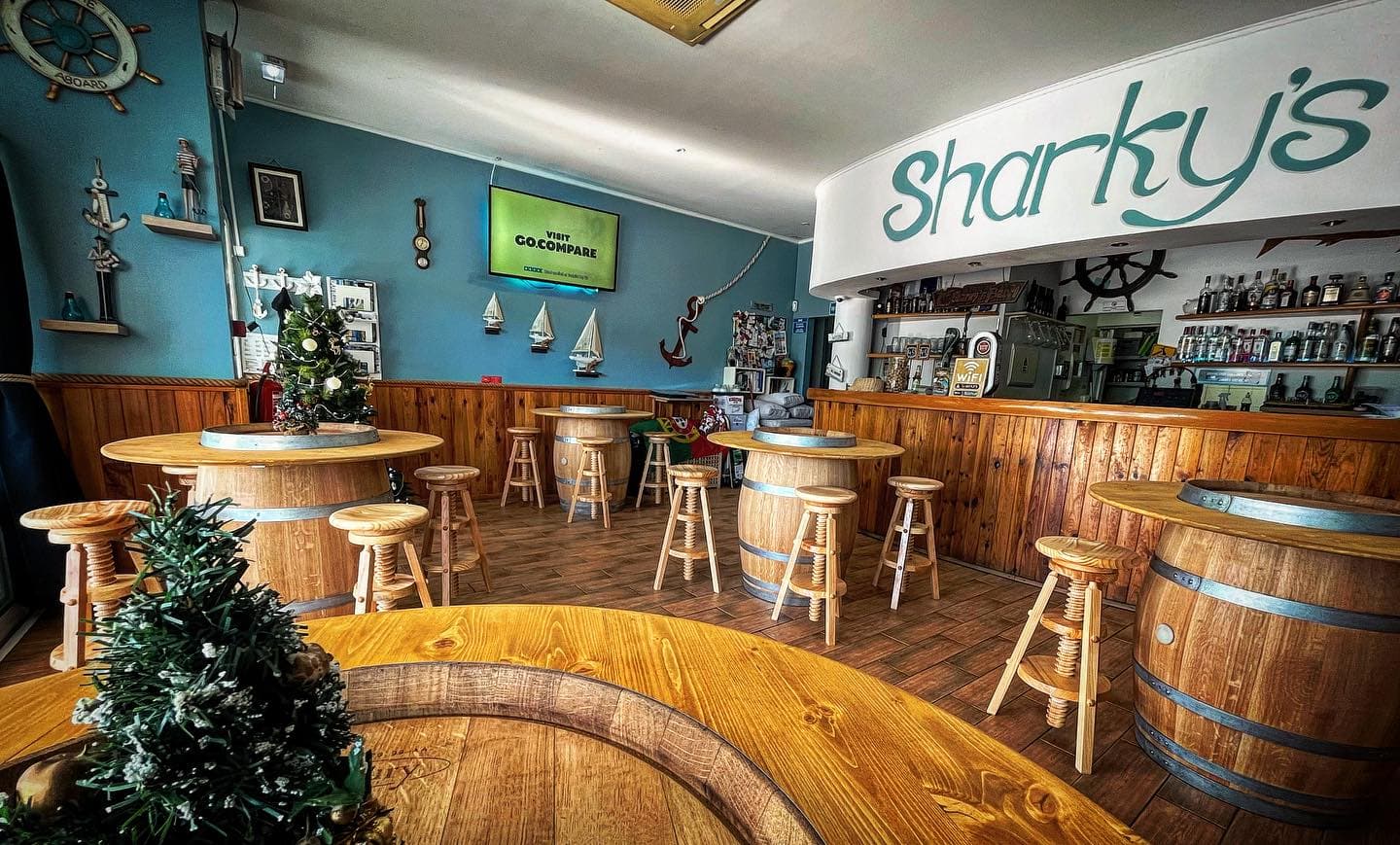 Interior of Sharky's Bar showing the cozy seating area and bar